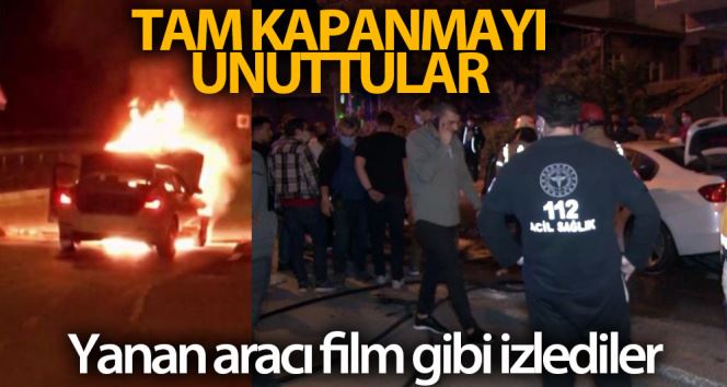 Ataşehir’de tam kapanmayı unutan vatandaşlar alev alev yanan lüks aracı film izler gibi izledi