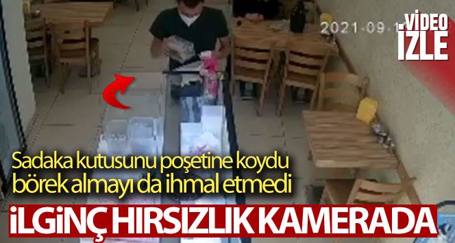 Sadaka kutusunu poşetine koyarak çaldı, börek alıp dükkandan çıktı