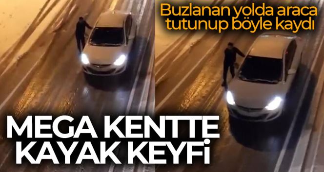 İstanbul’da ’sörf’ keyfi...Buzlanan yolda araca tutunup böyle kaydı