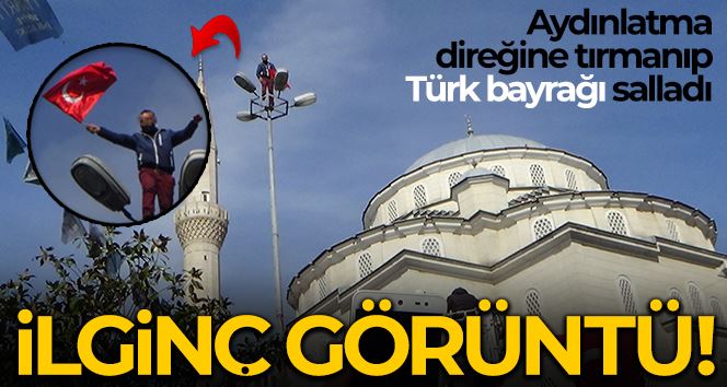 (Özel) Şişli’de ilginç görüntü: Aydınlatma direğine tırmanıp Türk bayrağı salladı